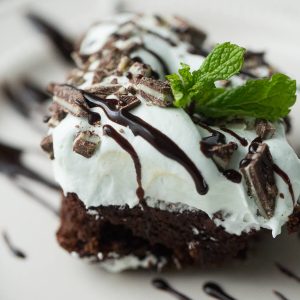 Ultra rich chocolate cake is topped with a creamy mint frosting in this easy to make mint chocolate cake
