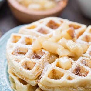 Homemade waffles made with browned butter and topped with rum spiced pears!
