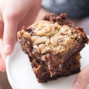 These Brookie bars have chocolate brownie base, a chocolate chip cookie top and a smooth chocolate caramel layer in the center!