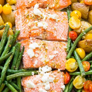 This Mediterranean salmon is baked simply with vegetables all in one sheet pan!
