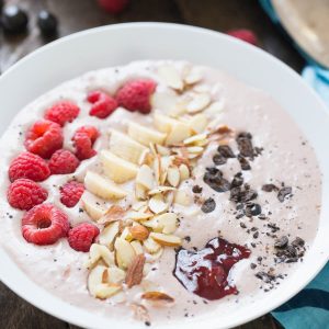 This smoothie bowl has a hint of mocha, strawberry and fresh fruit! The chocolate covered coffee beans make it a stand out! lemonsforlulu.com