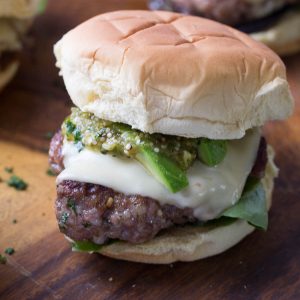 Pork burgers are a great change from the normal beef burger. These burgers have a simple Verde sauce on top!