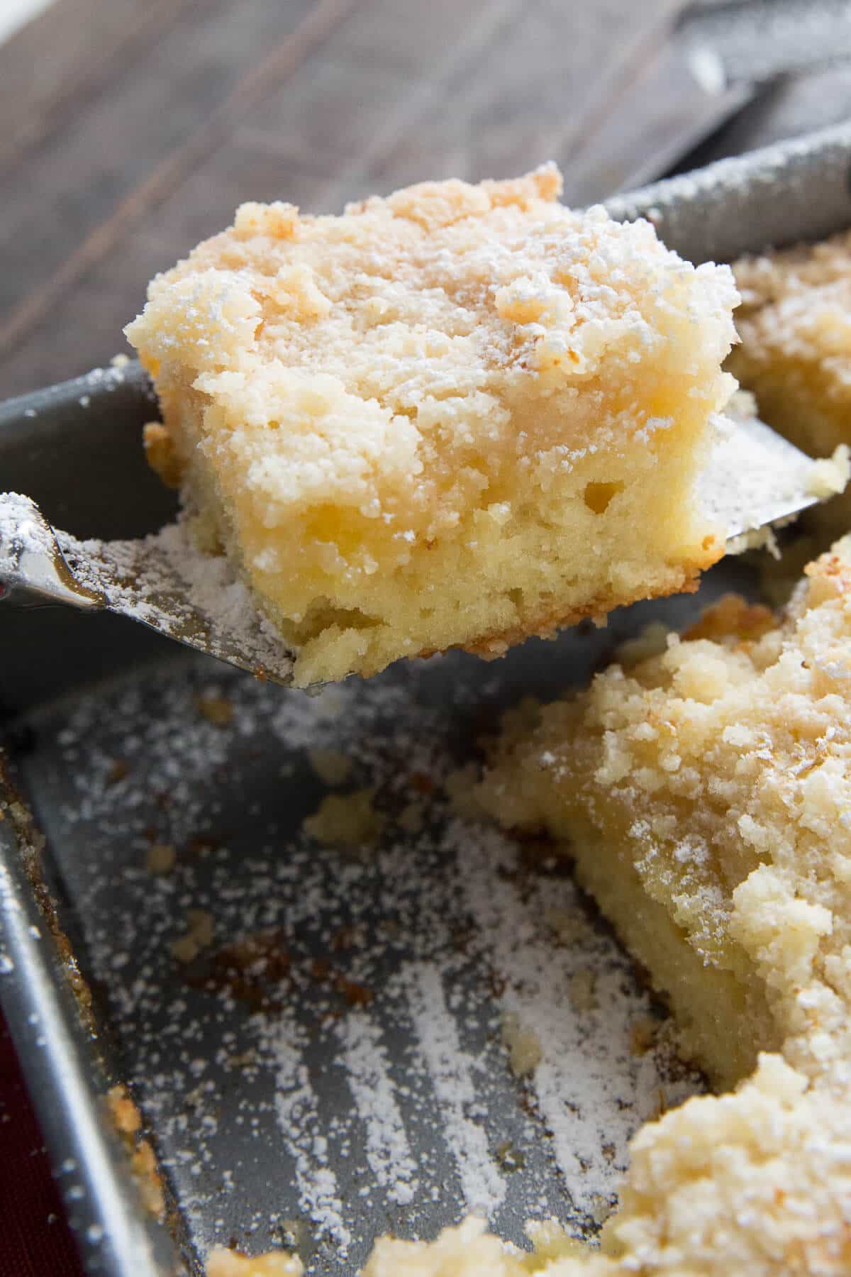 An ultra tender cake is topped with a tangy and smooth lemon curd topping and a buttery crumb coating. This Lemon Crumb Cake is more than an ordinary coffee cake. This cake is a dessert fit for a queen! A tender crumb cake that is filled with lemon flavor cannot be beat! All it needs is a cup of tea!