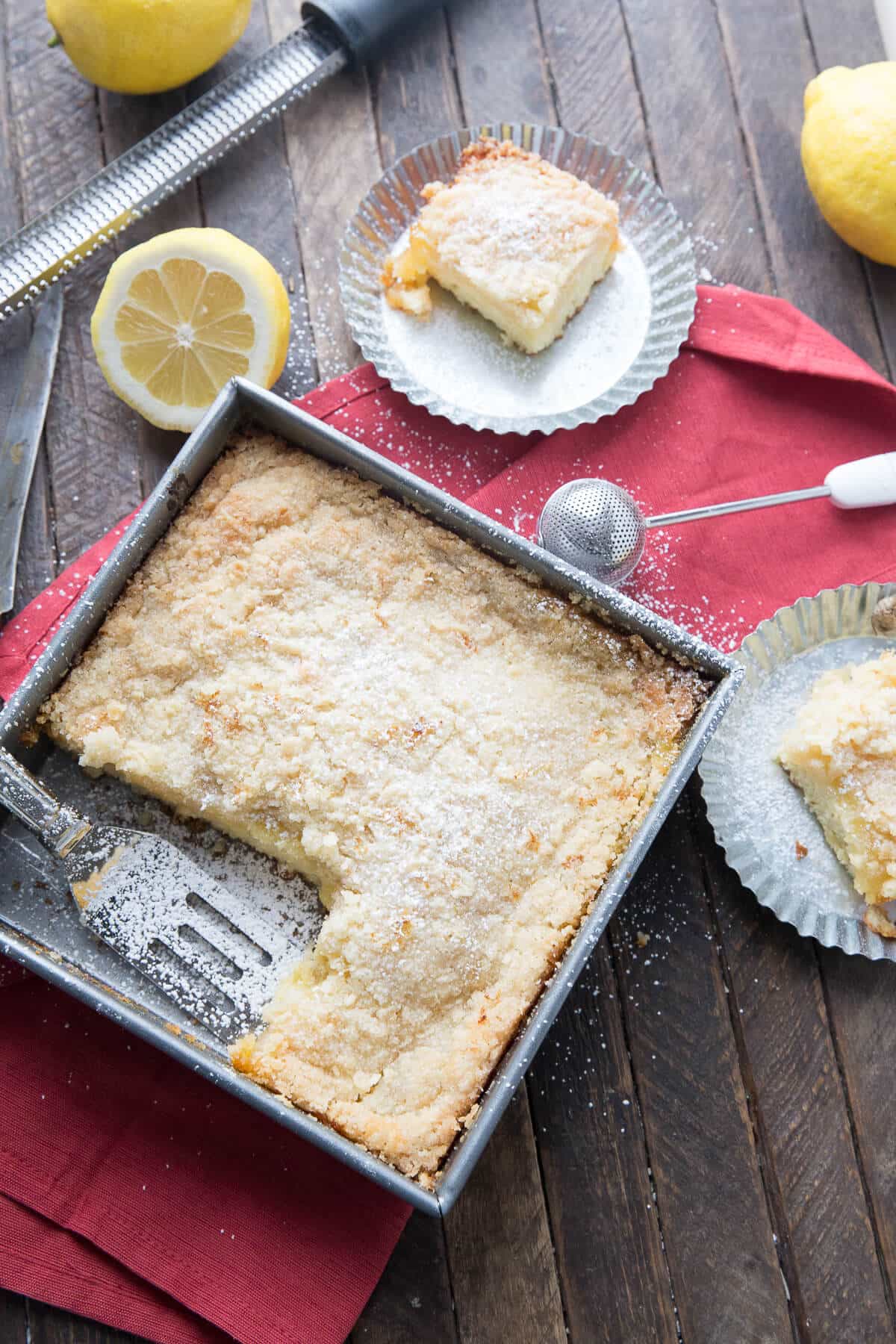 An ultra tender cake is topped with a tangy and smooth lemon curd topping and a buttery crumb coating. This Lemon Crumb Cake is more than an ordinary coffee cake. This cake is a dessert fit for a queen! This crumb cake is brimming from top to bottom with tangy, fresh, lemon flavor! It is so refreshing!