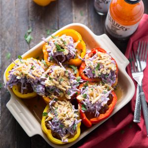 Southwest Stuffed Peppers are filled with brisket and topped with slaw!