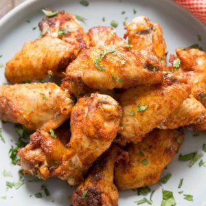 Dry rub chicken wings are like a party in your mouth! The spicy sweet coating is absolutely addictive!