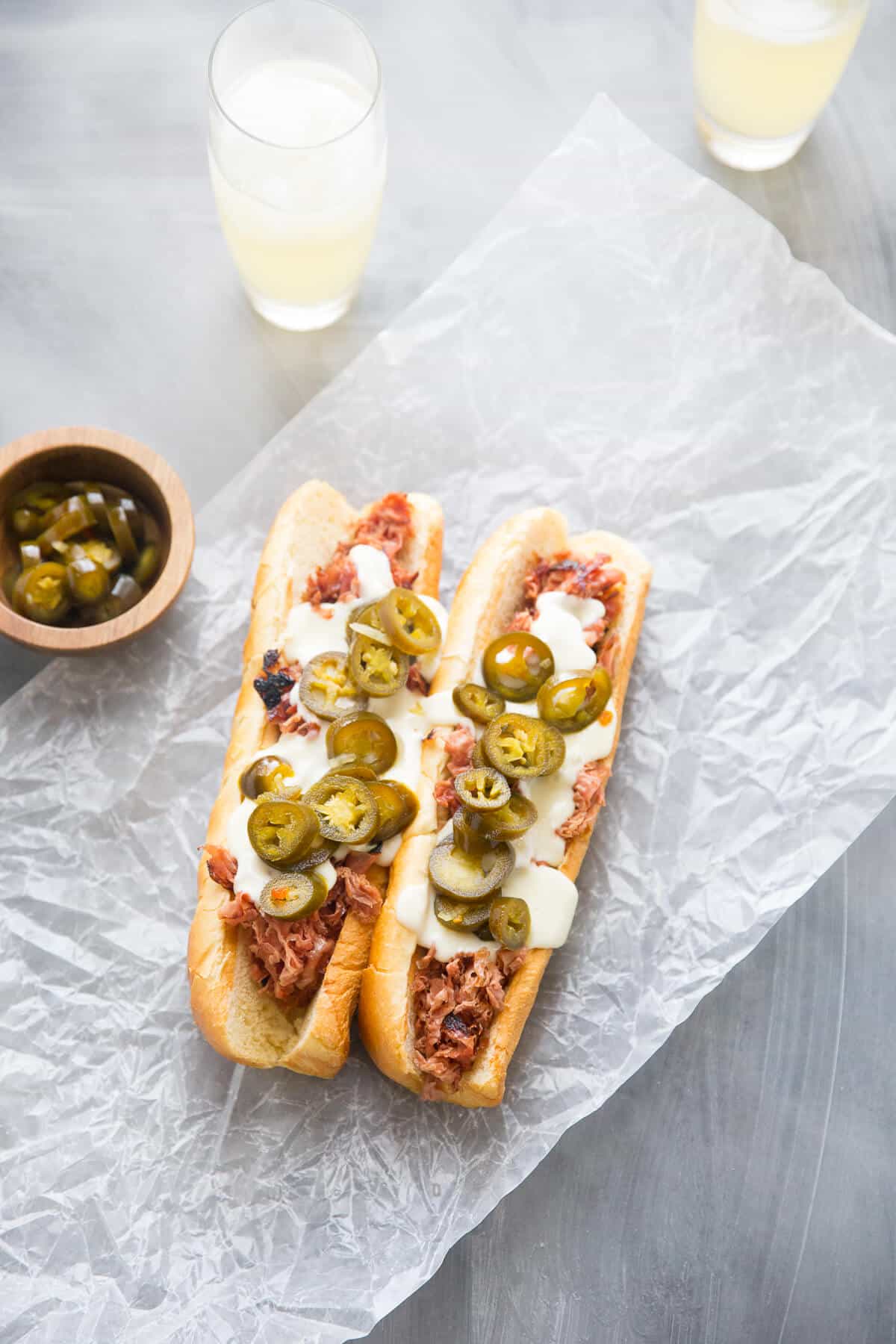 A fried bologna sandwich is getting an update! This sammy is topped with creamy beer cheese and jalapeños!