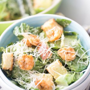 Crisp and cool lettuce is balanced by seasoned, grilled shrimp in this refreshing Shrimp Caesar Salad! Traditional Caesar salad dressing is replaced with an avocado dressing that adds just the right amount of creaminess to each bite!