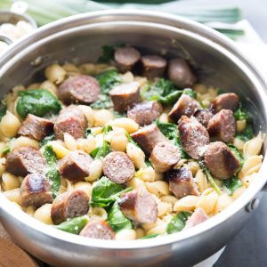 This light and creamy sausage pasta is luscious and flavorful. The spinach and leeks add color and freshness to this no-fuss recipe. This is a great meal for busy nights!'