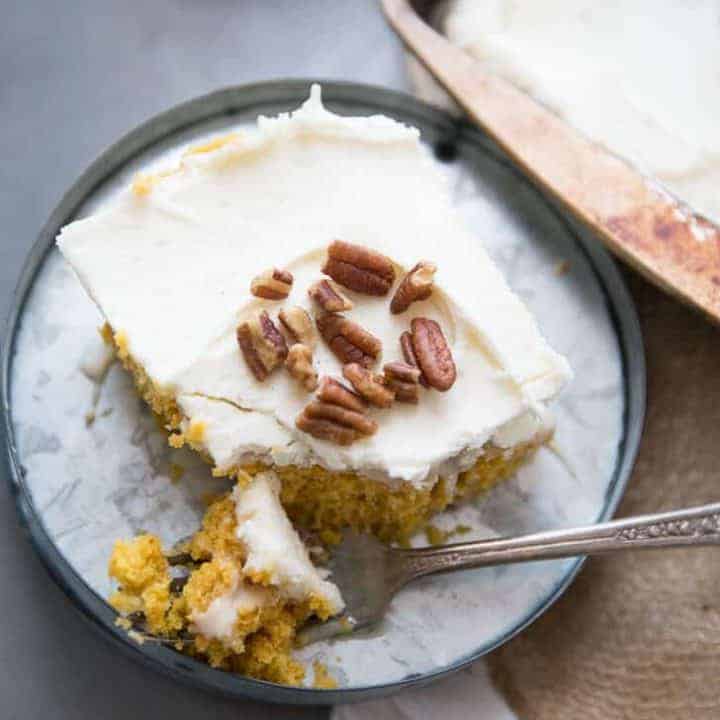 Love a good pumpkin roll but don't want to put in the time? I have just the solution! This easy poke cake takes everything we love about pumpkin rolls and turns it into an easy to assemble cake!