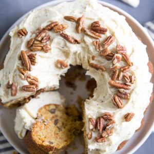 Homemade carrot cake recipe with slice on its side