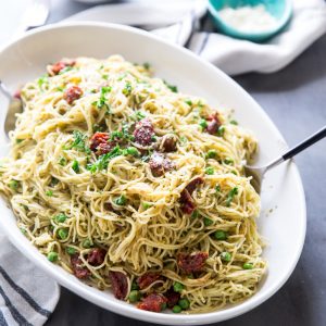 Pasta with peas on a platter side view