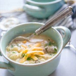 cheeseburger soup with cheese on top