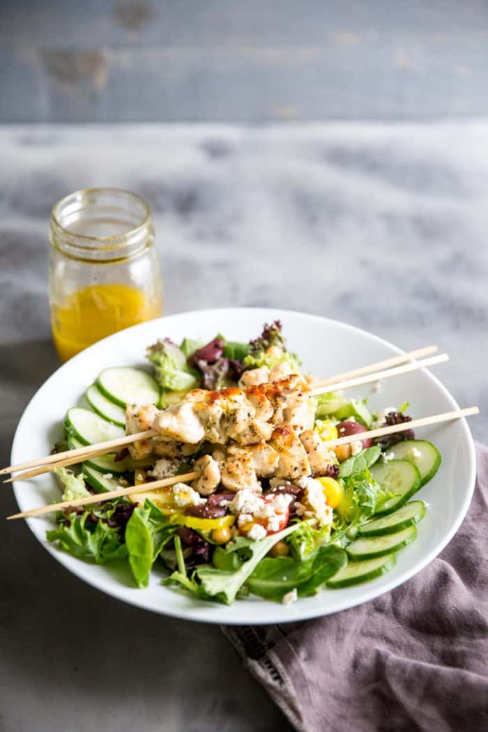 I love serving my family simple chicken recipes. This Greek chicken souvlaki recipe is exactly that! It's light and healthy but so flavorful, especially atop this Mediterranean salad! chicken souvlaki skewers