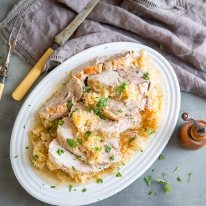 pork and sauerkraut with fork and knife