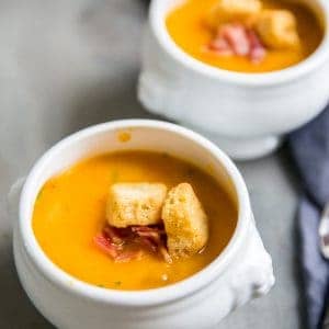 roasted butternut squash soup two white bowls