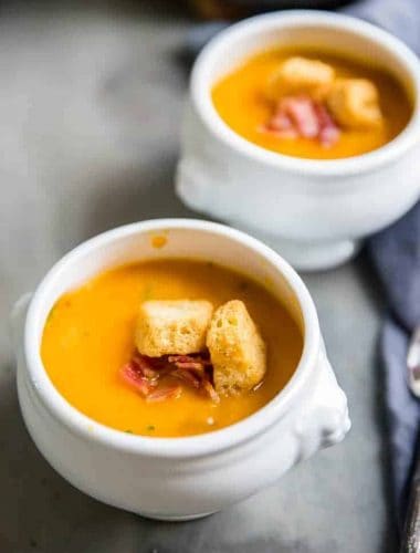 roasted butternut squash soup two white bowls